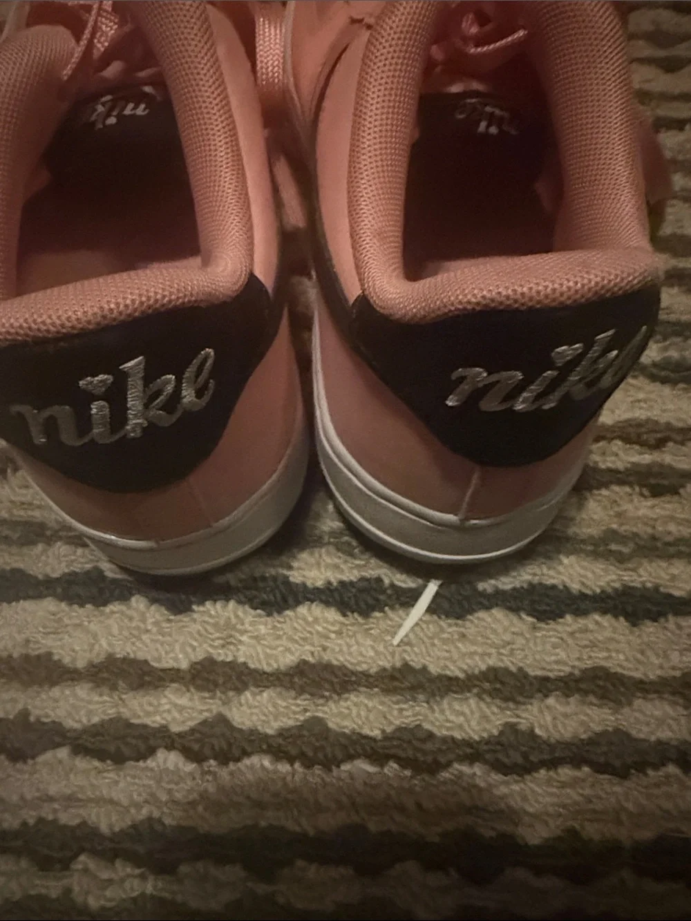 Nike Pink Low-Top Sneakers with Black Swoosh